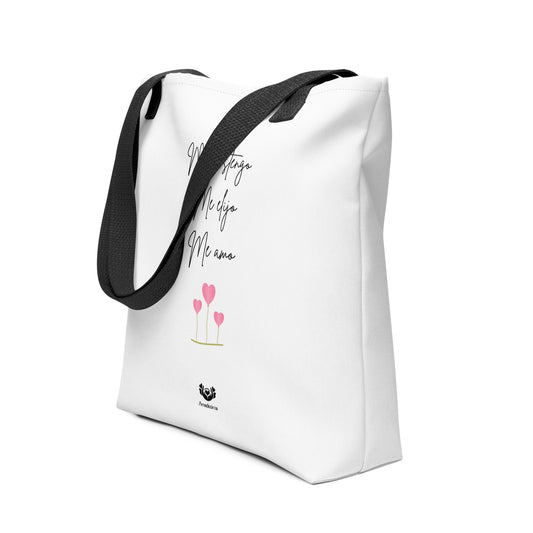 Bolsa tote blanca Amadíssima, vista lateral mostrando asas y textura, frase inspiradora visible.